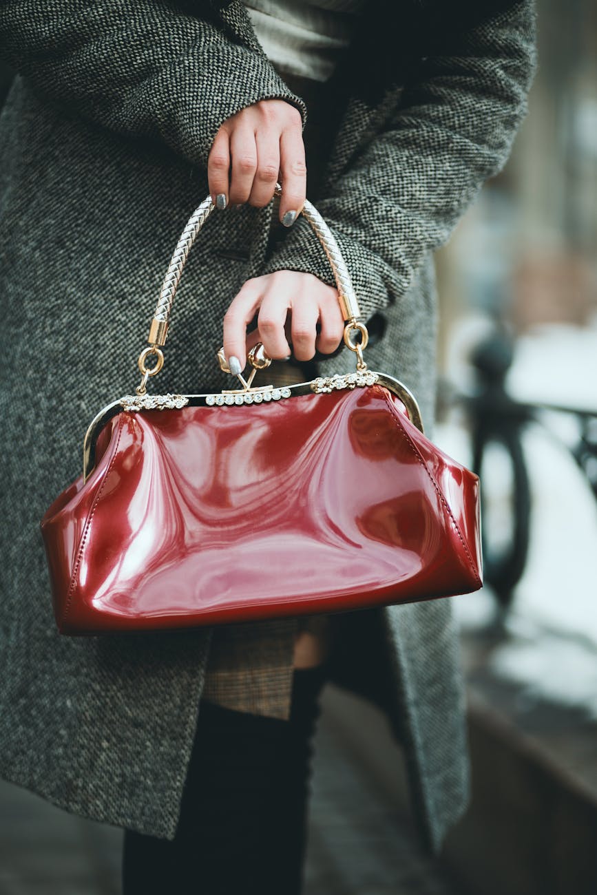 woman holding red handbag