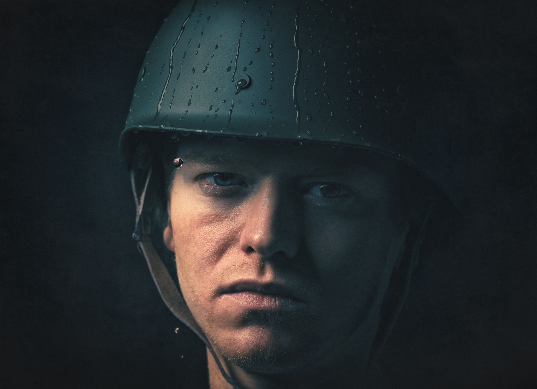 dramatic portrait of soldier with helmet