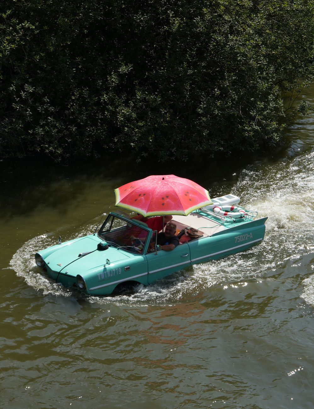 aqua car with umbrella in river adventure